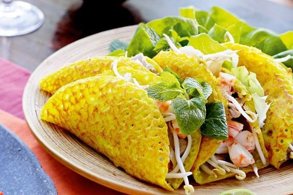 Crispy golden Vietnamese turmeric pancakes filled with shrimp and bean sprouts