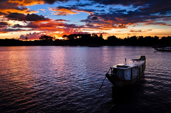 Dragon boat at sunset on Perfume River in Hue