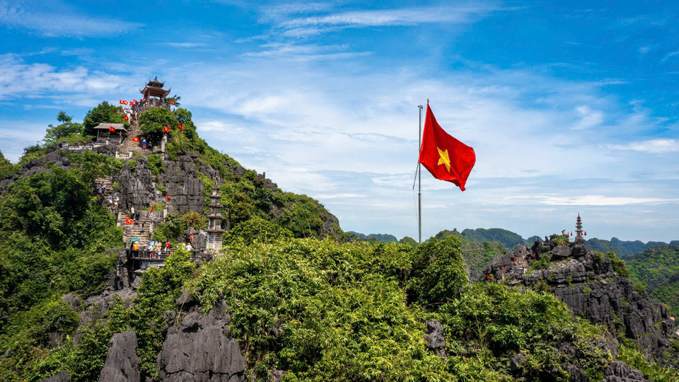 Stone staircases winding up Mua Cave mountain peak in Ninh Binh